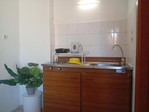 a small kitchen with a sink and a sink at on the STRIP-Studio 1 in Kavos