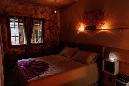 a bedroom with a bed and a window at Country house, peace comfort & love in Contagem