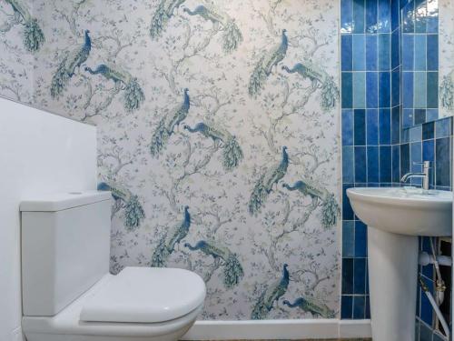 a bathroom with a toilet and a sink at 4 Bed in Seascale oc-85807 in Gosforth
