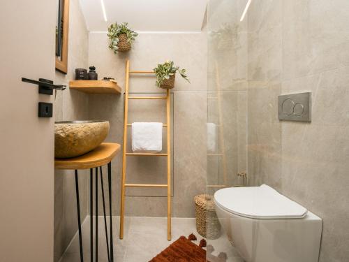 a bathroom with a toilet and a sink at Alavastros City Center in Zakynthos