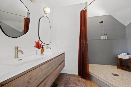 a bathroom with a sink and a mirror at Rockaway Mesa Dome Views Pool Karaoke Sauna in Yucca Valley