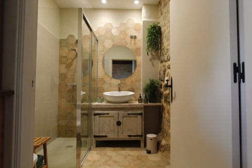 a bathroom with a sink and a mirror at "Dobela Enea" Cueva alojamiento privado in Laguardia