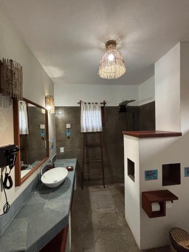 a bathroom with a sink and a shower at Pousada Lanea Experience in Atins