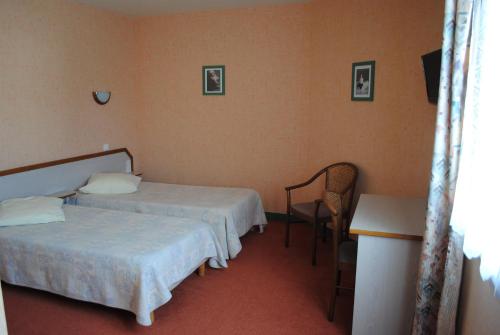 Ένα ή περισσότερα κρεβάτια σε δωμάτιο στο L'Orée Du Bois