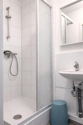 a bathroom with a shower and a sink at Apartments in Leuna in Leuna