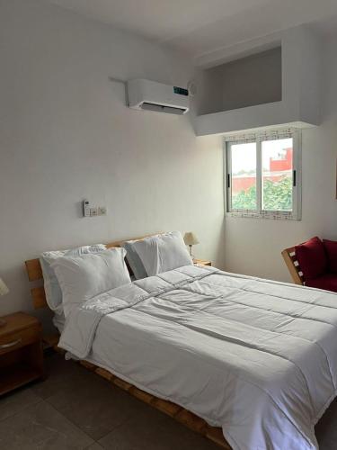 Vuode tai vuoteita majoituspaikassa Comme chez vous