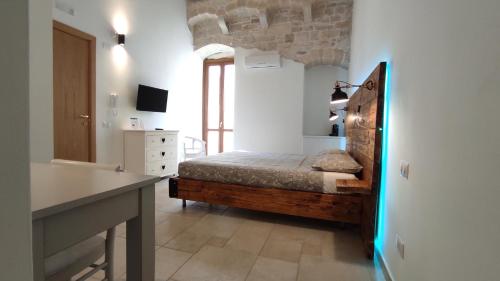 a bedroom with a bed and a sink in a room at ''B&B Santa Rita Corato fitta camere'' in Corato