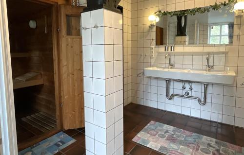a bathroom with a sink and a shower at Haus Birkenhof in Moorhausen