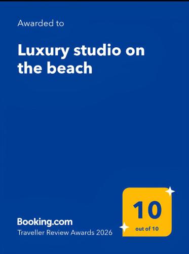a yellow sign with the number on it at Luxury studio on the beach in Ios Chora