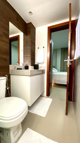 a bathroom with a toilet and a sink at Dom Carlos in Belém
