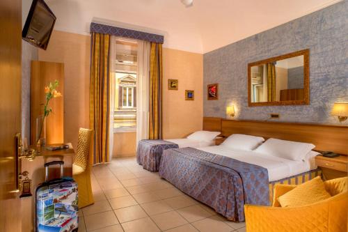 Krevet ili kreveti u jedinici u okviru objekta Hotel Assisi