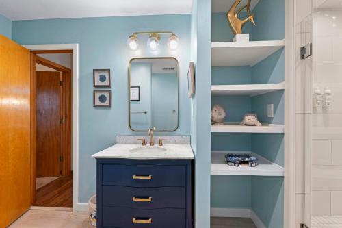 a bathroom with a sink and a mirror at The Pickled Mermaid in Rodanthe
