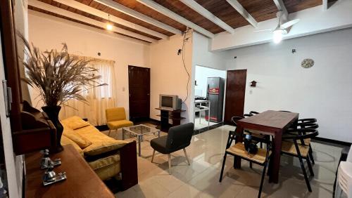 a living room with a couch and a table at Blend- Casa descanso Cafayate in Cafayate