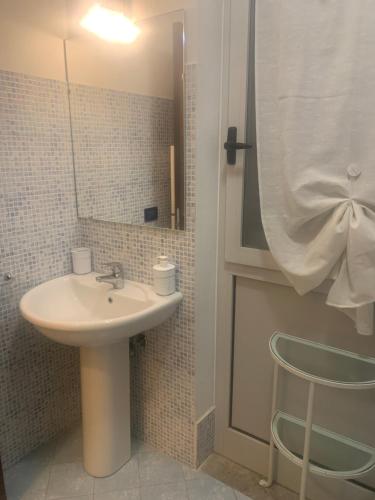 a bathroom with a sink and a mirror at La Terrazza in San Giovanni Valdarno