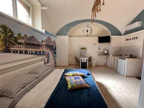 a bedroom with a large bed in a room at Dea in Maddaloni
