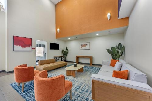 a large living room with a couch and chairs at Best Western Plus Austin Airport Inn & Suites in Austin