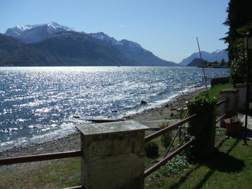 a view of a large body of water with mountains at Garden Rooms 1 in Menaggio