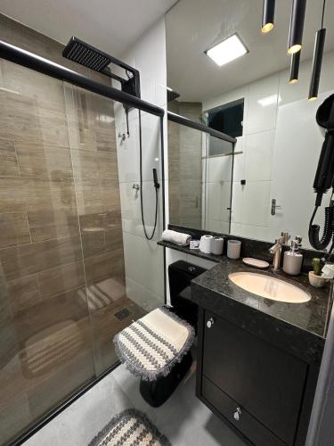 a bathroom with a shower and a sink at Apartamento Completo localizado no centro in Matias Barbosa