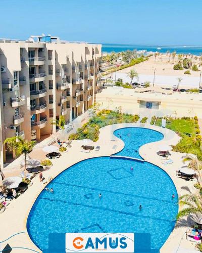 an aerial view of a resort with a large swimming pool at CAMUS 354, Princess Resort in Hurghada