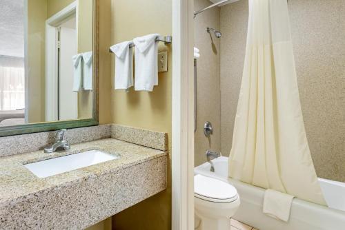 a bathroom with a sink and a toilet and a shower at Quality Inn Alachua - Gainesville Area in Alachua