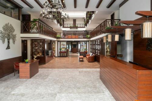 a library with a large room with bookshelves at The Fern Brentwood Resort, Mussoorie, Series by Marriott in Mussoorie