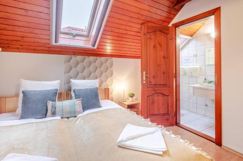 a bedroom with a large bed and a window at Calm and Relaxing Sleep in Soltvadkert