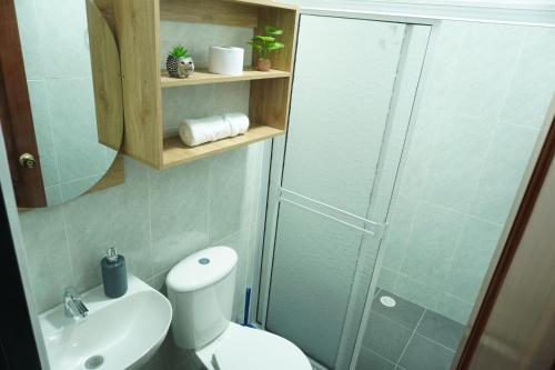 a bathroom with a shower and a toilet and a sink at Espacio Ideal 201 in Yopal