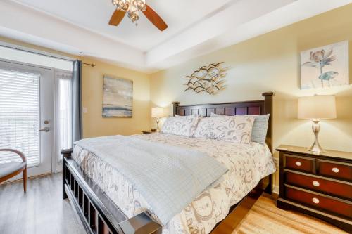 a bedroom with a large bed and a ceiling fan at River View Condo Sleeps 6 Shared Hot Tub & Pool in Pigeon Forge
