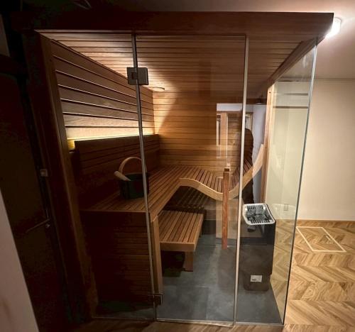 a small sauna in a room with a glass door at A luxurious accommodation experience surrounded by nature in Okazaki