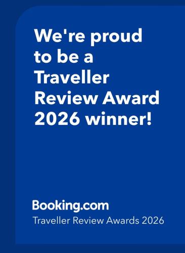 a blue sign that says were proud to be a traveler review award winner at Church Street Shop Top in Bellingen