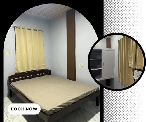 a small bedroom with a bed and a mirror at RobMar Haven in Sibulan