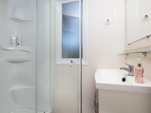 a bathroom with a shower and a sink at Cozy mobile home in Cesenatico in Cesenatico