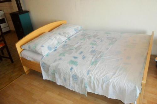 a bed in a room with a wooden frame at Studio Nevidjane 8401a in Neviđane