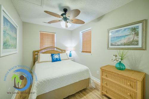 a bedroom with a bed and a ceiling fan at Windy Hill Villa 2 - Beach Retreat in Myrtle Beach