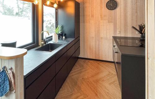 a kitchen with a sink and a counter at Gorgeous Home In Ebeltoft With Sauna in Ebeltoft