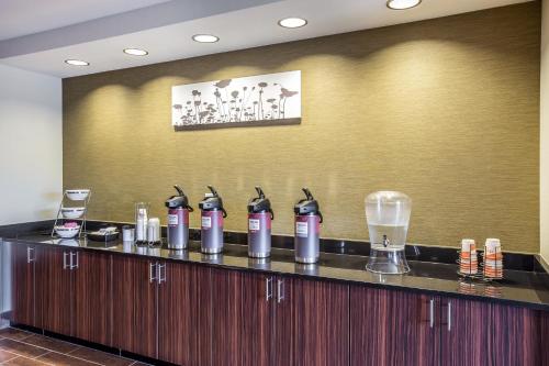 a bar in a hotel room with bottles of water at MainStay Suites Cartersville in Cartersville