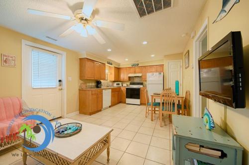 a kitchen and living room with a ceiling fan at Windy Hill Villa B - Blue Reef in Myrtle Beach