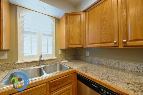 a kitchen with a sink and a window at Windy Hill Villa 3 - Beach Charm in Myrtle Beach