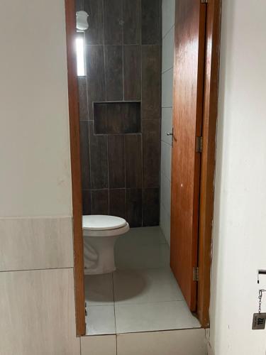 a bathroom with a toilet and a shower at Palace Hotel in Anápolis