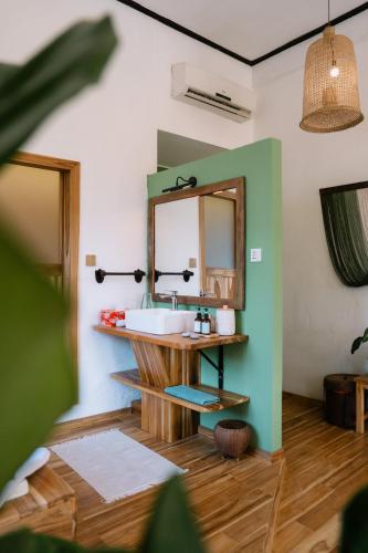a bathroom with a sink and a mirror at Baan Samsa in Luang Prabang