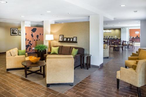 a lobby with couches and chairs and a table at MainStay Suites Cartersville in Cartersville