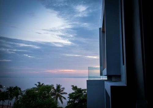a view of the ocean from a building at Kalm Bangsaen Hotel in Bangsaen