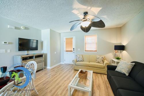 a living room with a couch and a ceiling fan at Windy Hill Villa 2 - Beach Retreat in Myrtle Beach