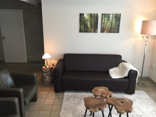 Coin salon dans l'établissement Park De Haeghehorst