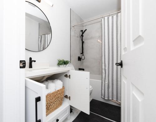 a bathroom with a sink and a mirror at Vacation Home in Vaughan in Vaughan
