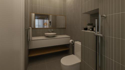 a bathroom with a sink and a toilet and a mirror at Dimora Blu Maldives in Dharavandhoo