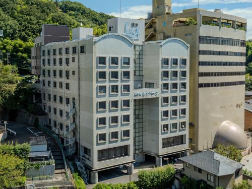 an aerial view of a building in a city at Hotel Luna Park in Matsuyama