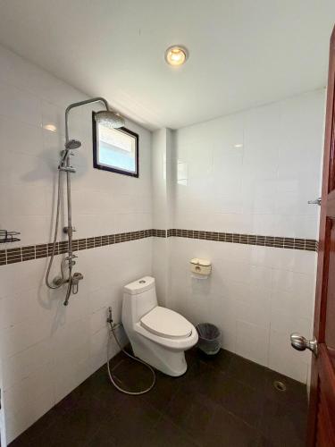 a bathroom with a toilet and a shower at Paihappyvillage in Pai