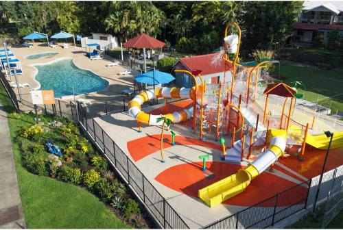 an outdoor water park with a water slide at Discovery Parks - Airlie Beach in Airlie Beach