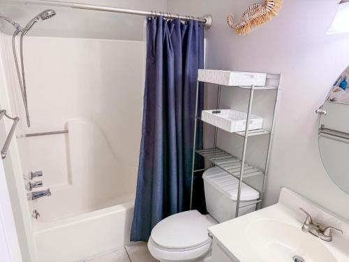 a bathroom with a toilet and a sink and a shower at Ocean Shores 301 in North Myrtle Beach